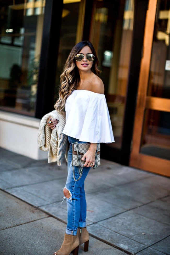 fashion blogger mia mia mine wearing a white off-the-shoulder top