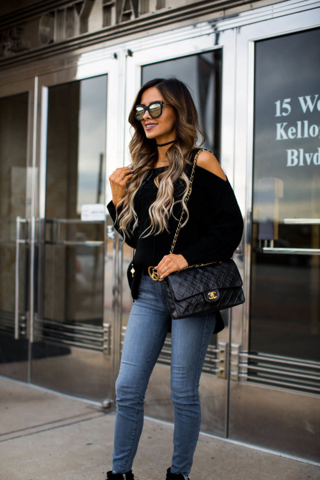 fashion blogger mia mia mine wearing a black cold shoulder sweater by sanctuary and henri bendel sunglasses
