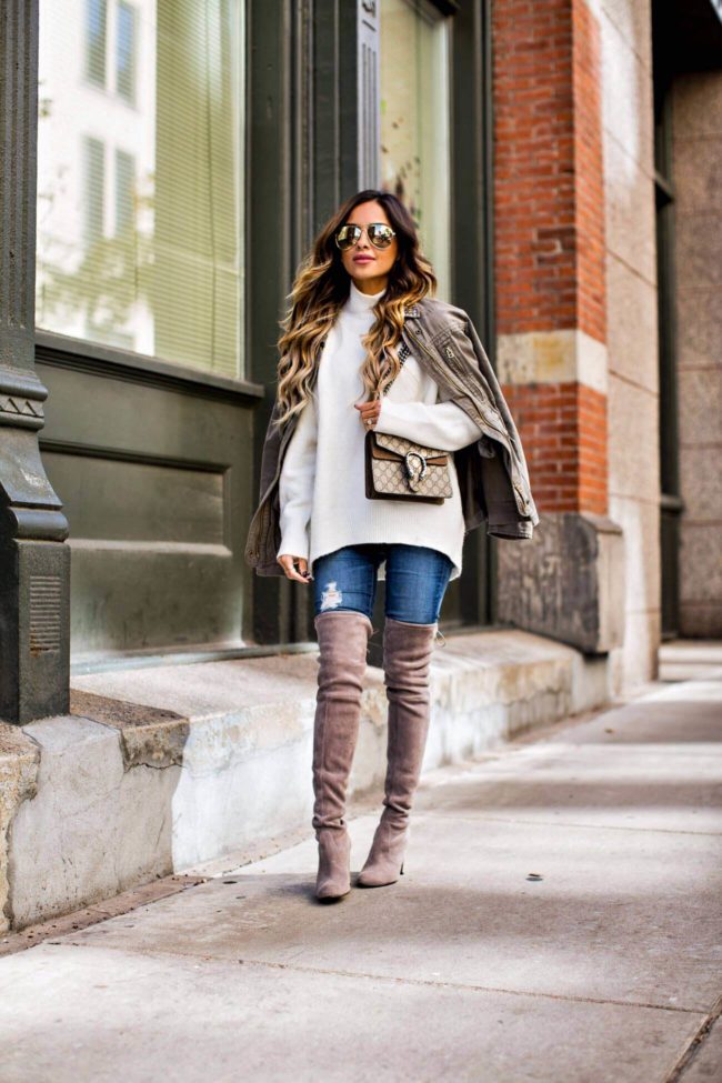 fashion blogger mia mia mine wearing a white turtleneck sweater and over-the-knee boots from nordstrom