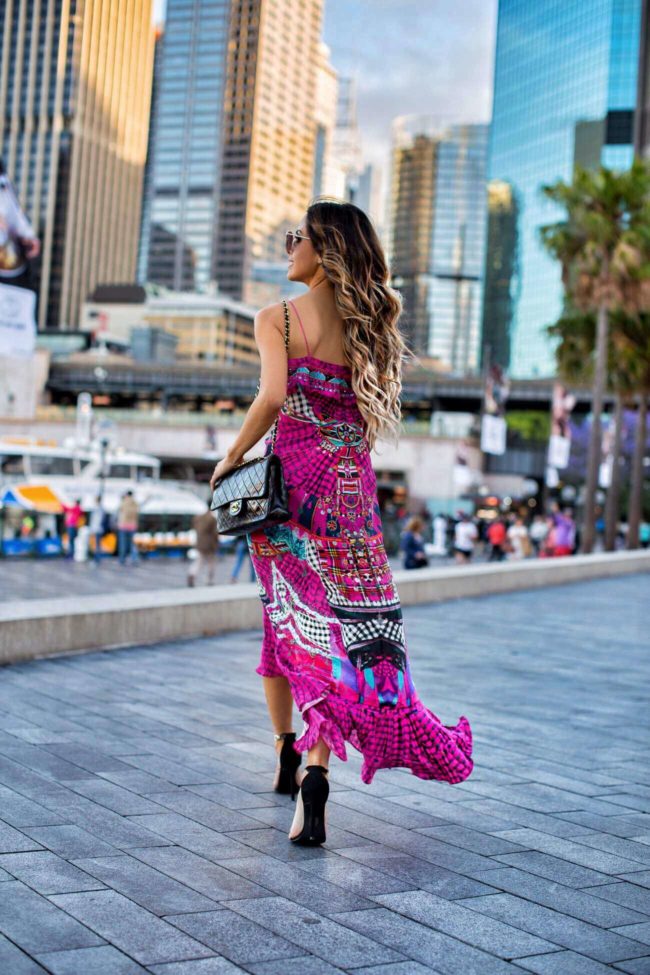 fashion blogger mia mia mine wearing a pink dress in sydney