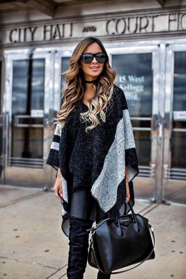 fashion blogger Mia Mia Mine in a sole society poncho and black leather pants