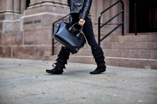 fashion blogger Mia Mia Mine wearing fringe boots from minnetonka moccasin