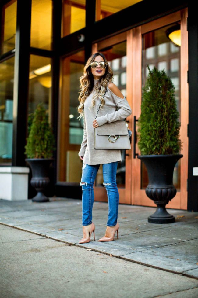 fashion blogger mia mia mine wearing a cold shoulder sweater from nordstrom and ag jeans 