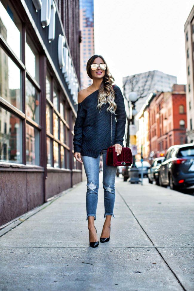 fashion blogger mia mia mine wearing a gray off-shoulder sweater and gray distressed jeans from express