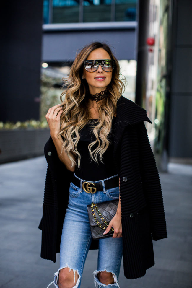 Fashion blogger mia mia mine wearing a black sweater coat from Nordstrom and a Vanessa mooney choker