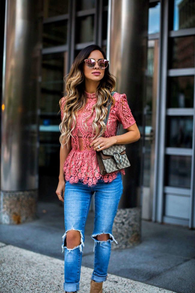 mn fashion blogger mia mia mine in a pink lace top from shopbop and levi's ripped jeans