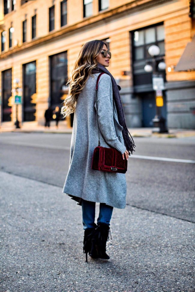 Fashion blogger mia mia mine wearing a gray sweatercoat and a burgundy bag from nordstrom