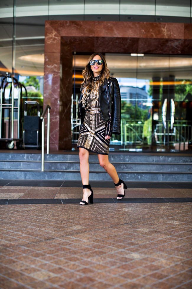 Fashion blogger Mia Mia Mine wearing a gold sequin dress and black heels from missguided