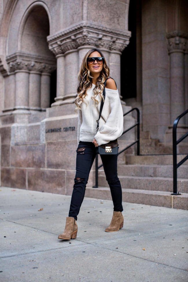mia mia mine wearing tan suede booties and black topshop distressed jeans