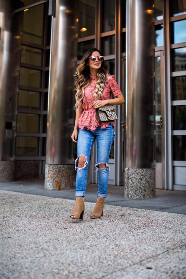 fashion blogger mia mia mine wearing a pink lace top from shopbop and carrying a gucci dionysus bag