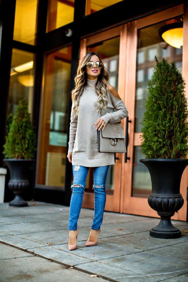 mn fashion blogger mia mia mine in a cold shoulder tunic sweater from nordstrom and AG jeans