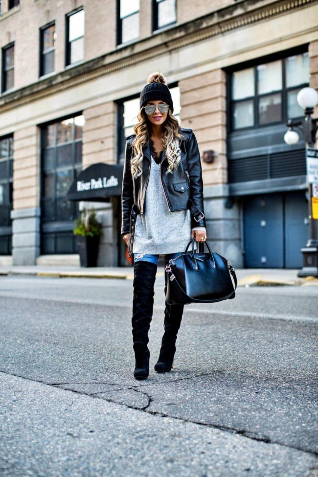 fashion blogger mia mia mine wearing an oversized tunic sweater from nordstrom and a leather jacket 