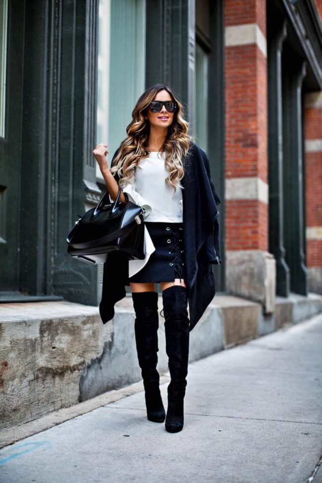 fashion blogger mia mia mine wearing a statement sleeve top and over-the-knee boots from nordstrom