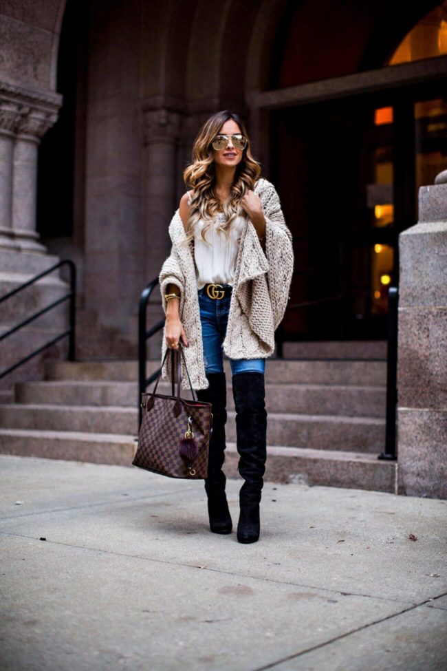 fashion blogger mia mia mine wearing a cable-knit wrap from asbydf and steve madden over-the-knee boots