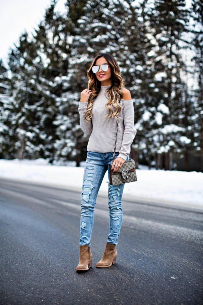 fashion blogger mia mia mine wearing a winter outfit from express