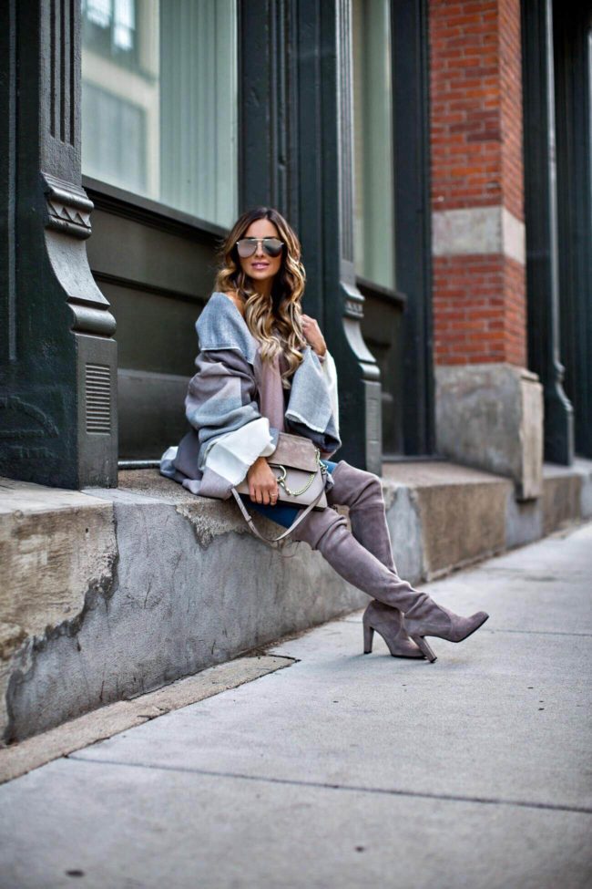 fashion blogger mia mia mine wearing a blanket scarf from asos and stuart weitzman over-the-knee boots