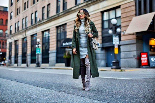 fashion blogger mia mia mine wearing stuart weitzman highland boots and an olive trench coat from asos