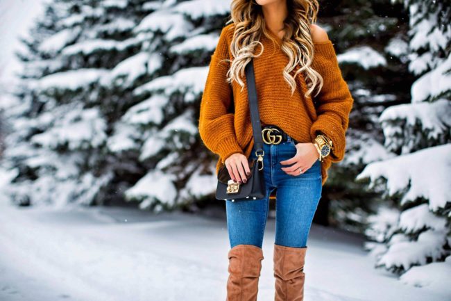 fashion blogger mia mia mine wearing a gucci belt and off-the-shoulder sweater from nordstrom