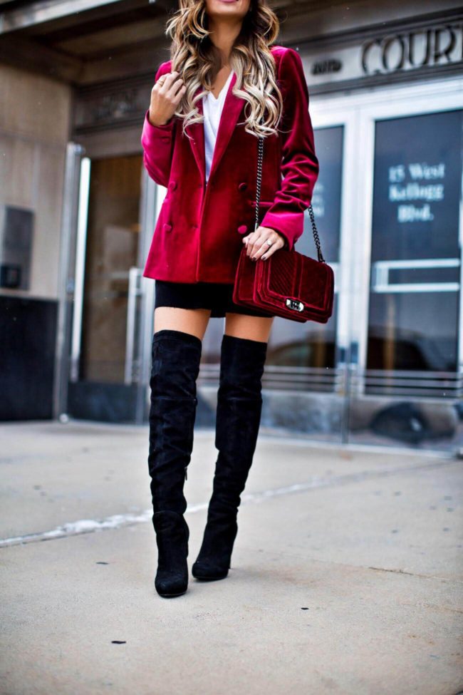 fashion blogger mia mia mine wearing over-the-knee black boots from nordstrom and a burgundy velvet blazer