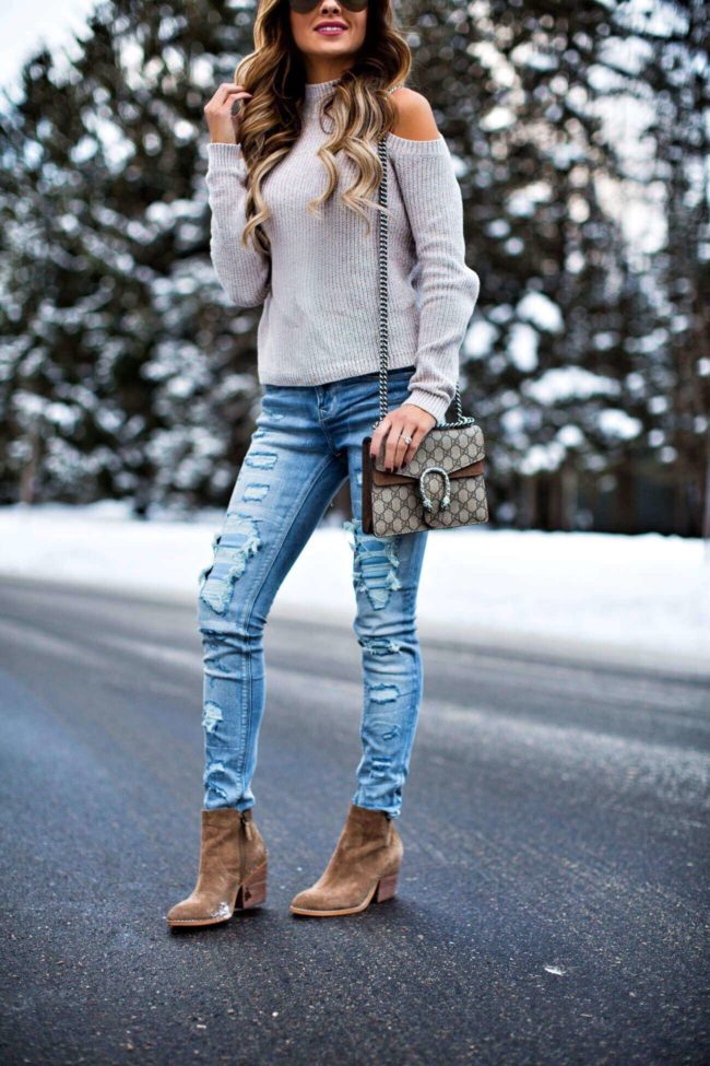 fashion blogger mia mia mine wearing ripped jeans from express and a cold-shoulder sweater