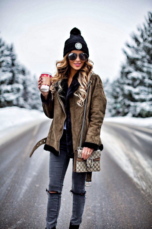 fashion blogger mia mia mine wearing a shearling topshop jacket and a herschel black hat from nordstrom