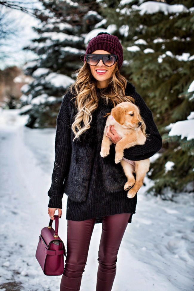 fashion blogger mia mia mine wearing a faux fur vest from topshop and burgundy leather pants from nordstrom