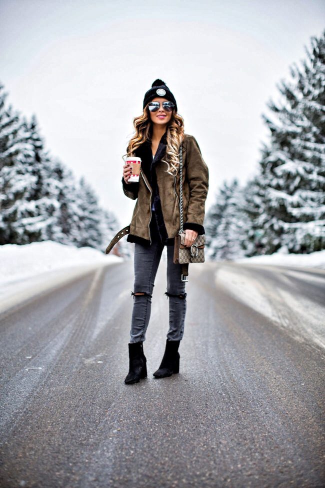 fashion blogger mia mia mine in an olive shearling topshop jacket and asos jeans