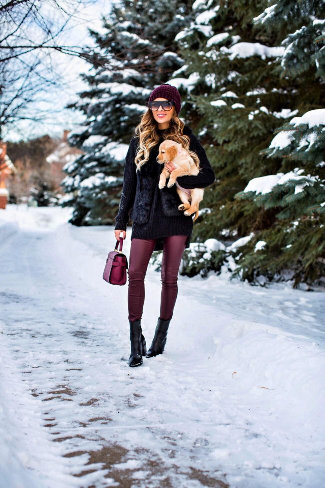fashion blogger mia mia mine wearing burgundy leather pants and a faux fur black vest from nordstrom