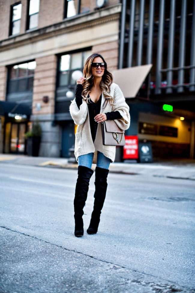 fashion blogger mia mia mine wearing a rollas cardigan from revolve and over-the-knee boots from nordstrom
