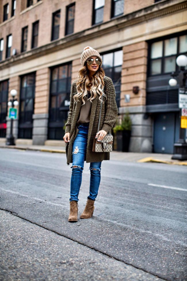 fashion blogger mia mia mine wearing an olive cardigan from nordstrom and a gucci dionysus bag