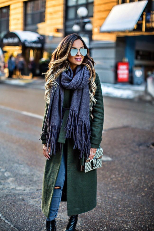 fashion blogger mia mia mine wearing a gray scarf and le specs the prince sunglasses