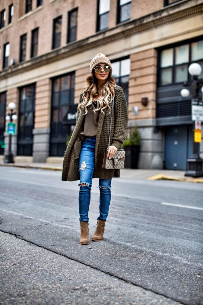 fashion blogger mia mia mine wearing a waffle knit cardigan from nordstrom and ag jeans with suede booties