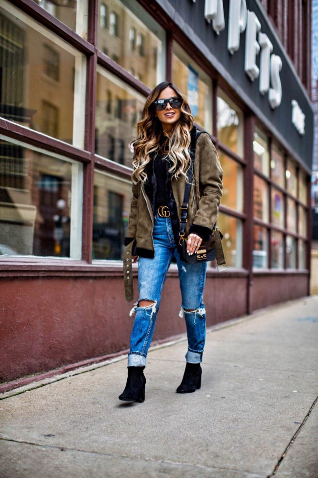 fashion blogger mia mia mine wearing a khaki shearling jacket from nordstrom and steve madden suede booties