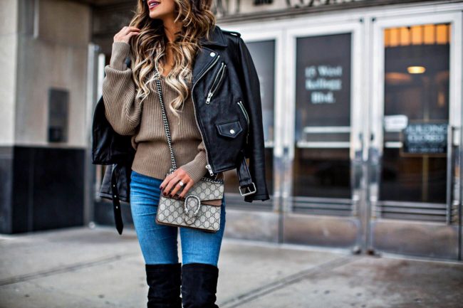 fashion blogger mia mia mine wearing a gucci dionysus bag and a leather jacket