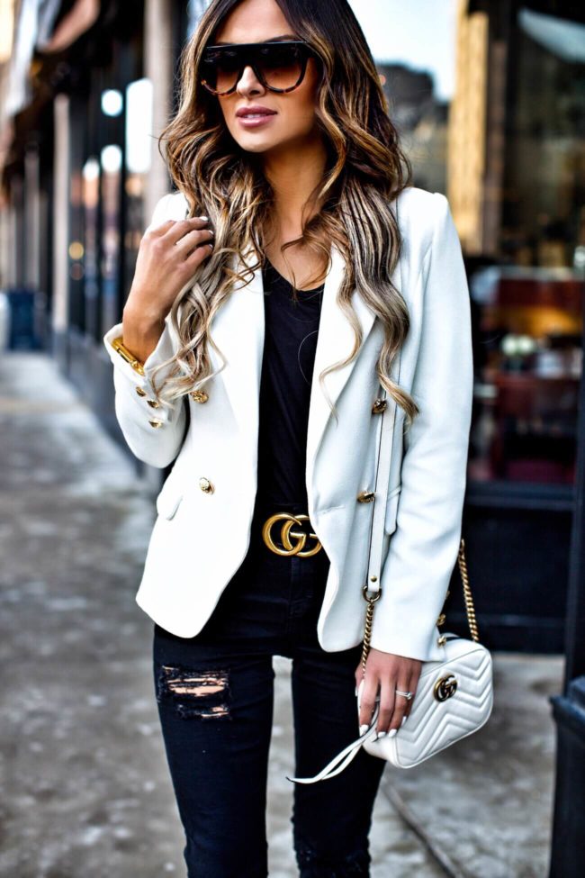 fashion blogger mia mia mine wearing a gucci double g buckle belt and a white marmont bag