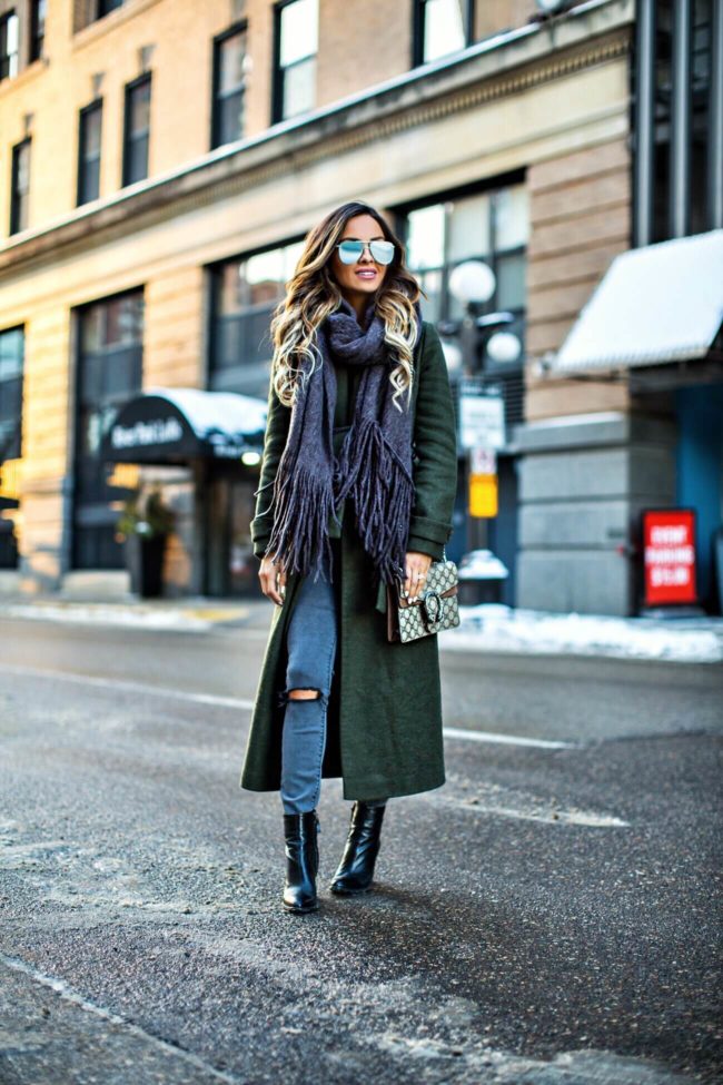 fashion blogger mia mia mine wearing a green trench coat from nordstrom and a free people brushed scarf