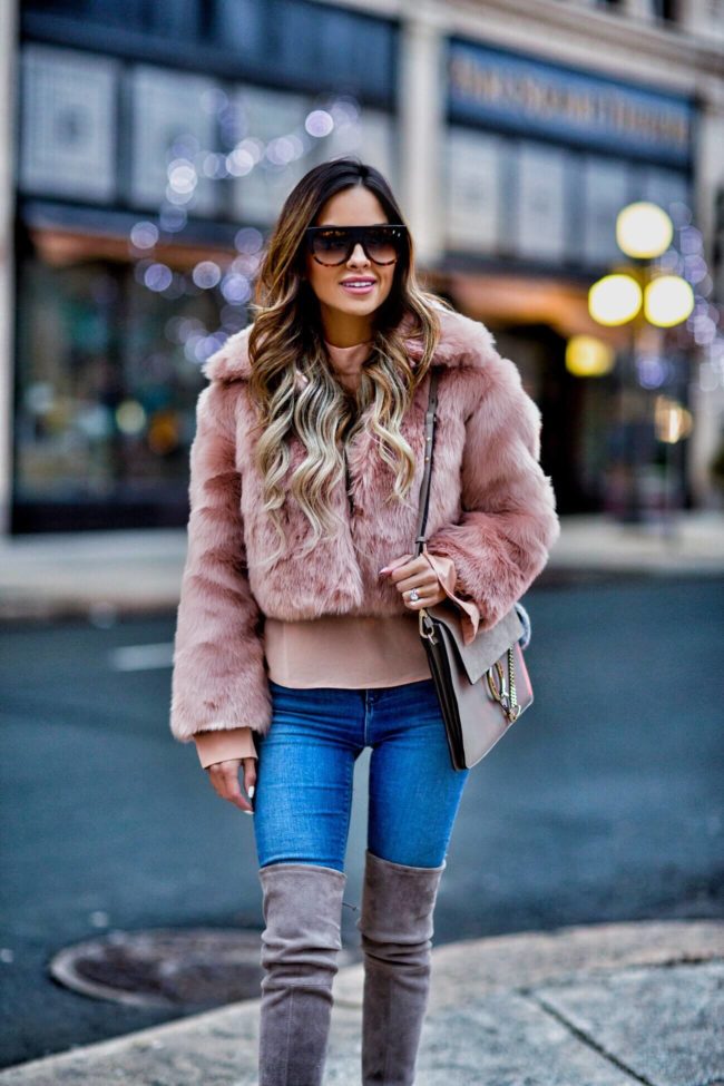 fashion blogger mia mia mine wearing a celine sunglasses and a faux fur blush jacket