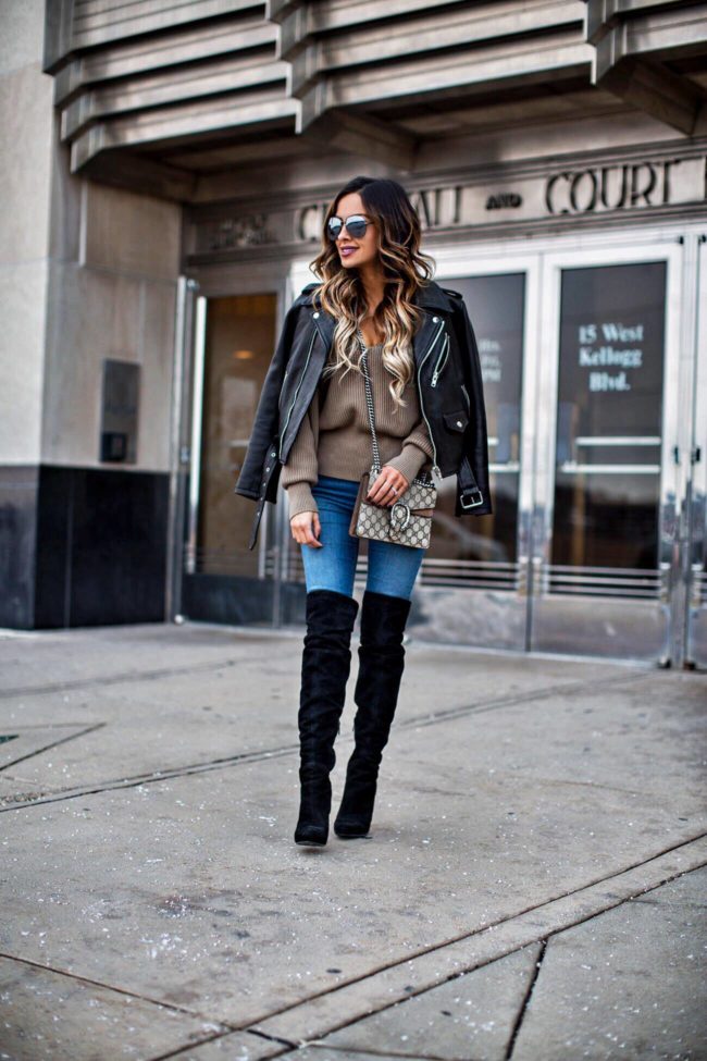 fashion blogger mia mia mine wearing a gucci bag and a leather jacket