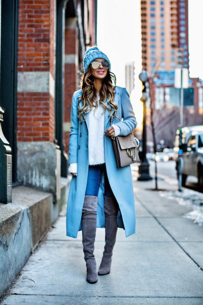 fashion blogger mia mia mine wearing a baby blue coat from nordstrom and stuart weitzman over-the-knee boots