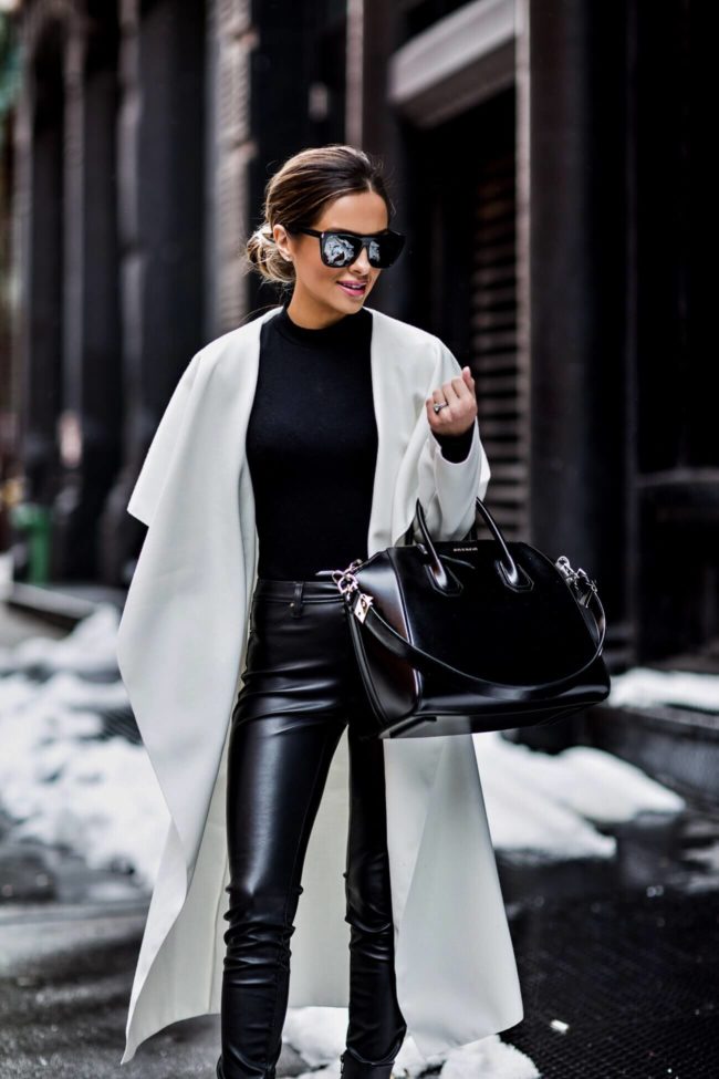 fashion blogger mia mia mine wearing a white coat at NYFW february 2017