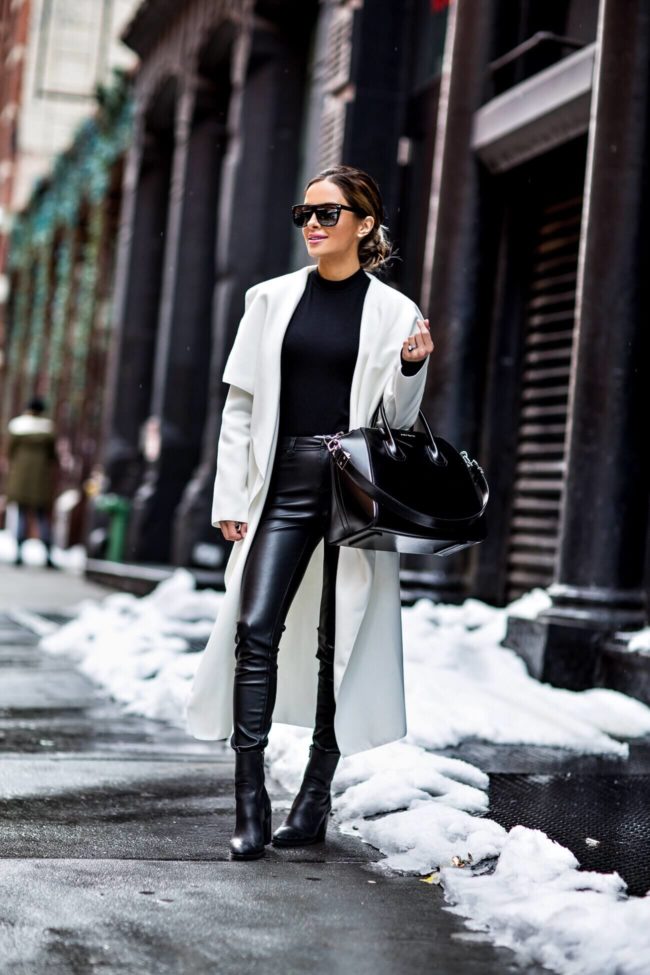 fashion blogger mia mia mine wearing a white waterfall coat by missguided and a givenchy bag from nordstrom at NYFW February 2017