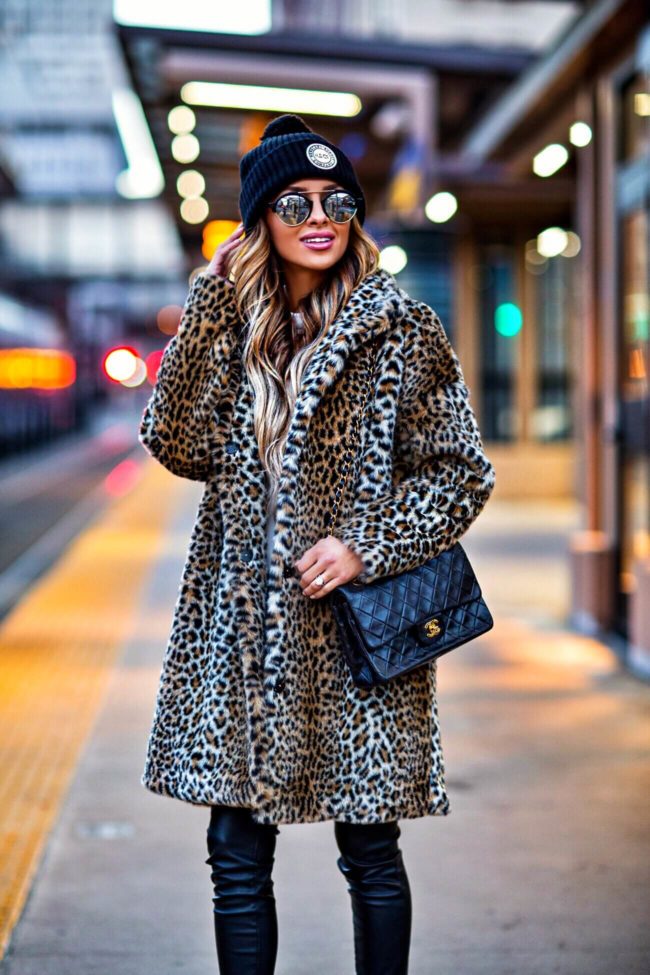 fashion blogger mia mia mine wearing a leopard coat and beanie