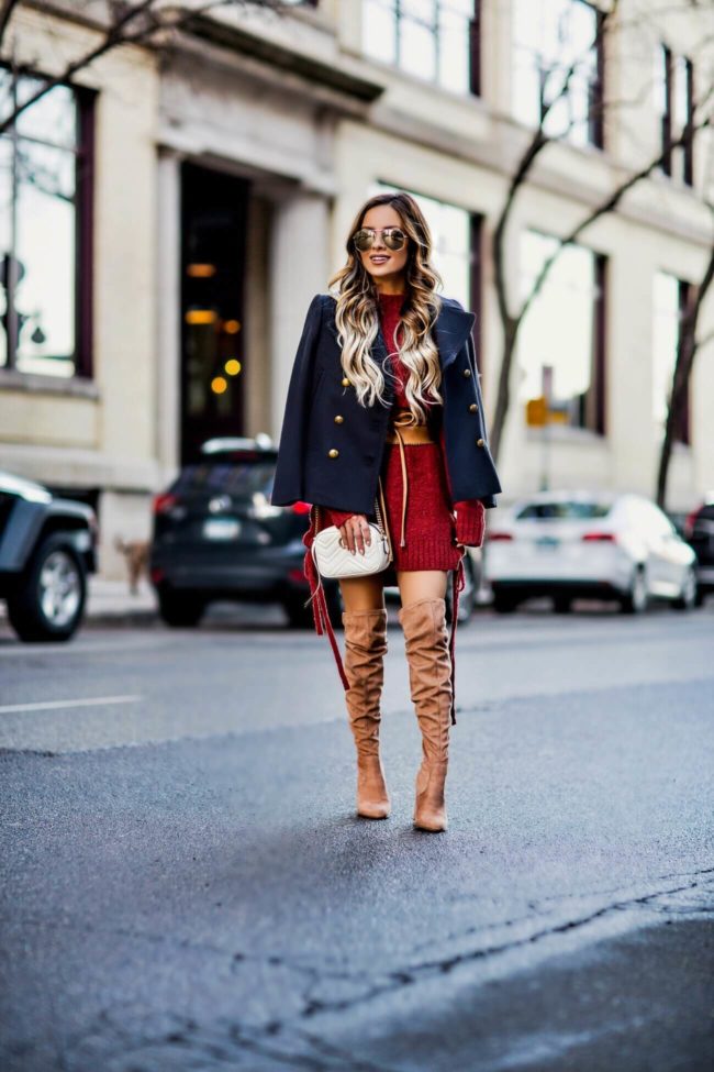 fashion blogger mia mia mine wearing a lace-up sweater dress by lovers + friends from revolve and a banana republic navy peacoat