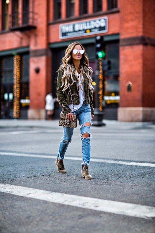 fashion blogger mia mia mine wearing distressed denim from revolve and a khaki suede blank nyc jacket