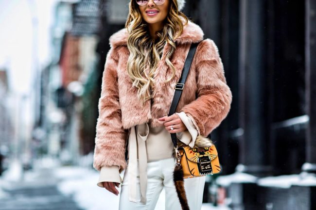fashion blogger mia mia mine carrying a furla metropolis leone bag in orange