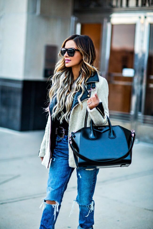 fashion blogger mia mia mine wearing a shearling jacket from asos and ripped jeans from revolve