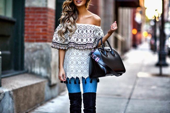 fashion blogger mia mia mine wearing a tassel top from revolve and a givenchy bag from nordstrom