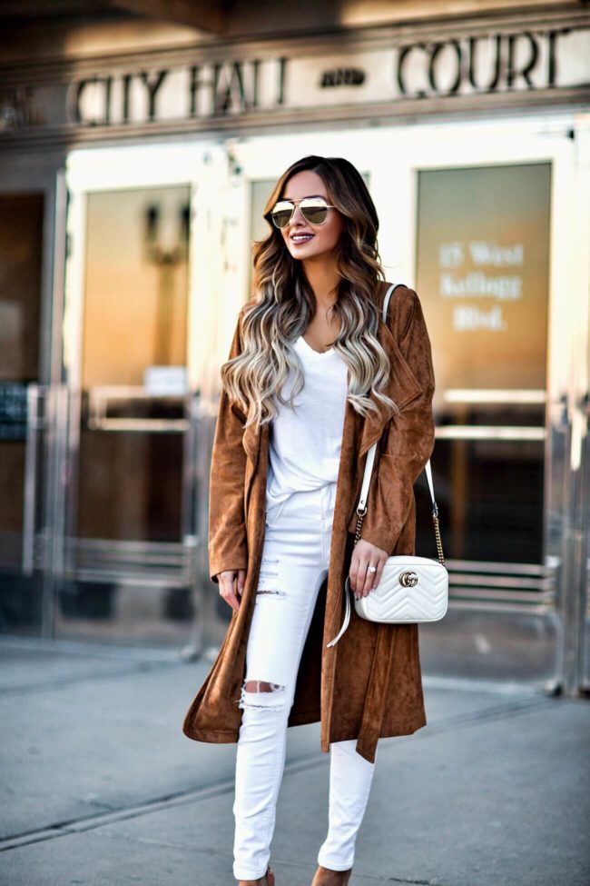 fashion blogger mia mia mine carrying a gucci marmont white bag and a bb dakota suede coat