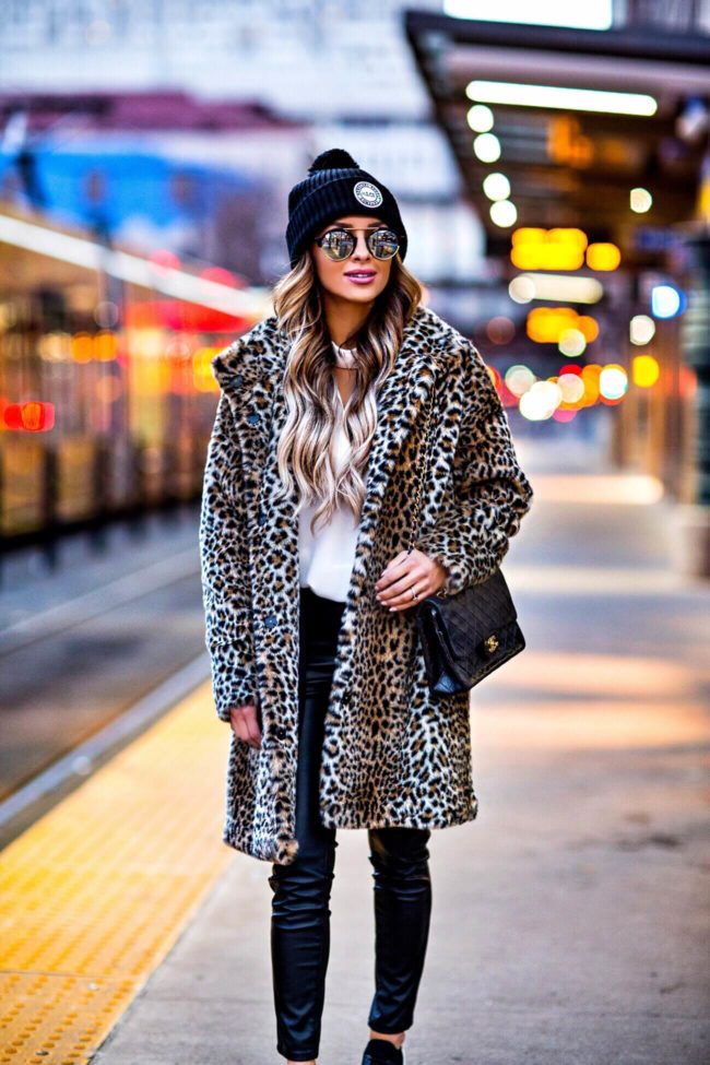 fashion blogger mia mia mine wearing a leopard coat from zara and a herschel hat 