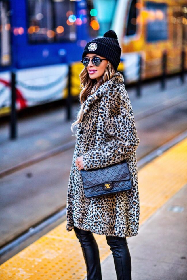 fashion blogger mia mia mine wearing a leopard coat and chanel bag